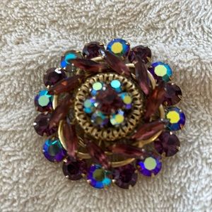 Iridescent rhinestone brooch.